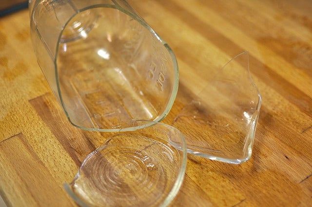 Kitchen Sink And Countertop With Glass Jars Of Food Stock Photo