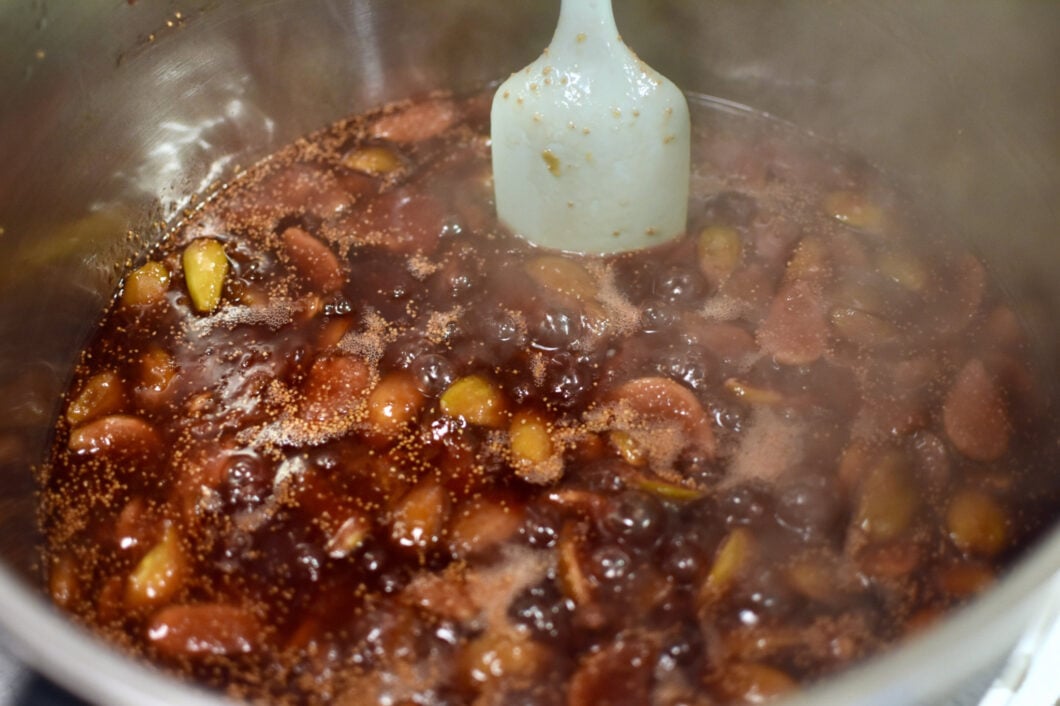 Stirring the cooking fig jam.