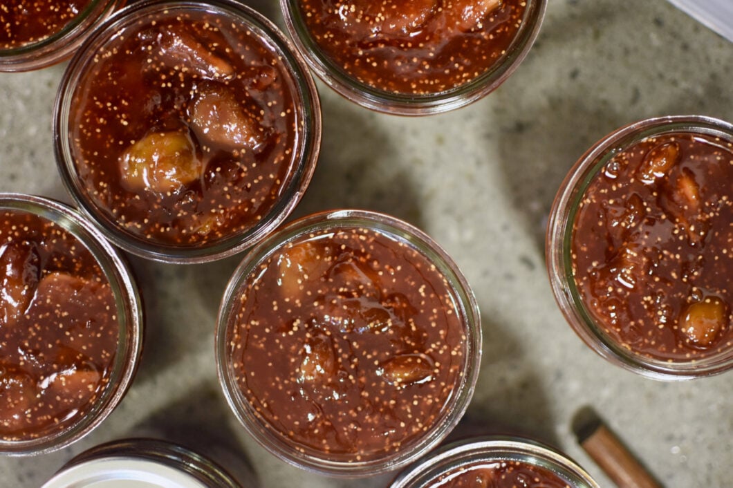 Top view of half pint jars filled with salted vanilla fig jam.
